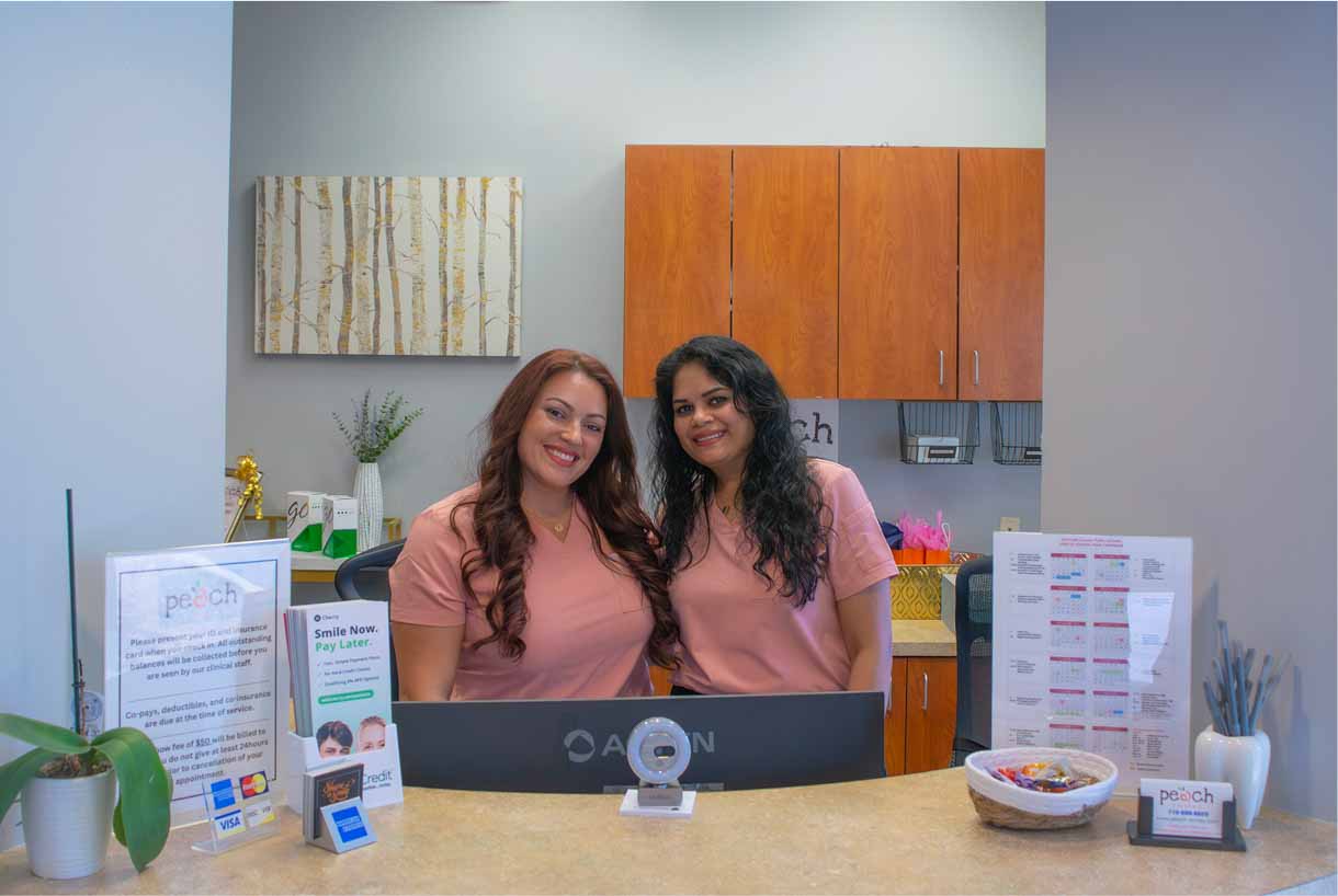 Smiling dental team standing together in the office